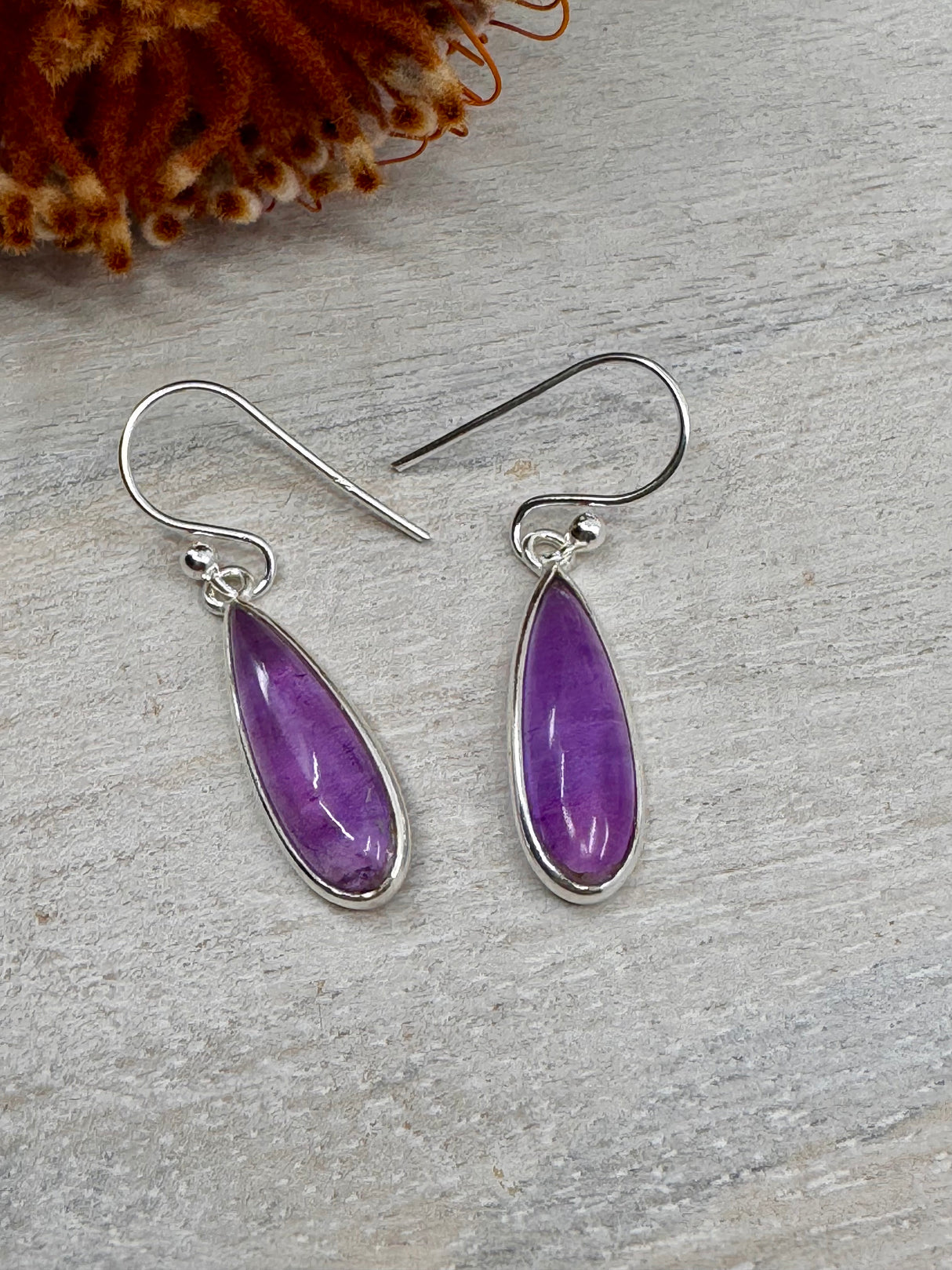 Purple amethyst gemstone drop earrings set in sterling silver