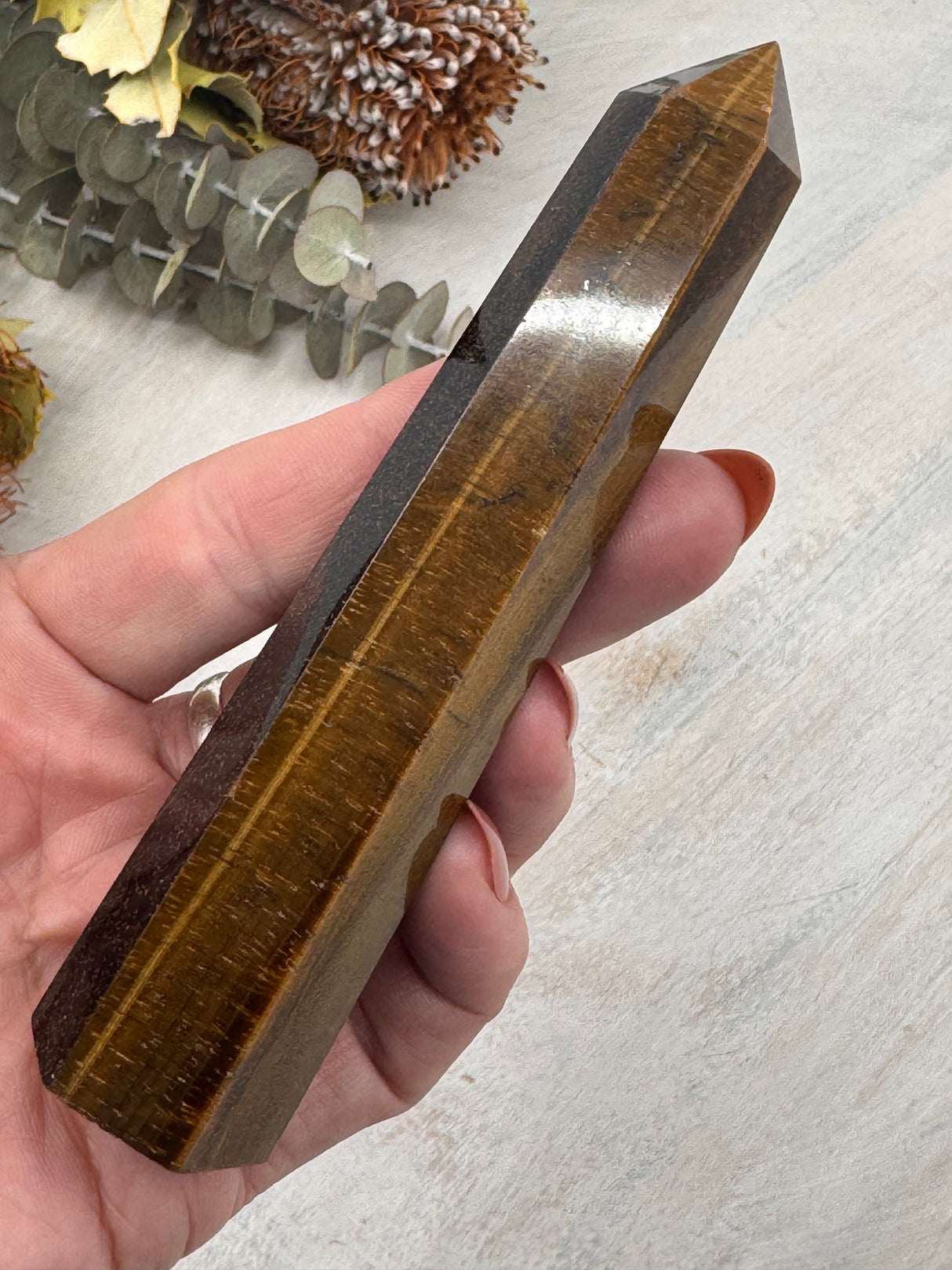 6-Sided Tiger Eye Point 12 cm × 3 cm – golden-brown crystal point symbolising courage, grounding and strength, Inspired By 3 Australia.