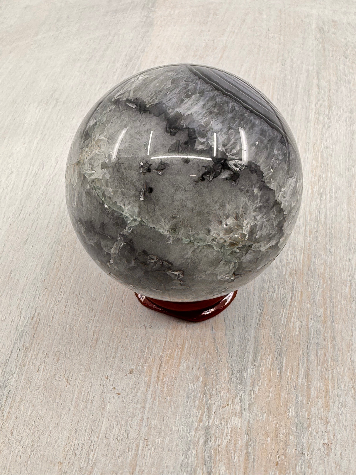 Banded Black Agate Sphere 230g - "I release all behaviours that no longer serve me."