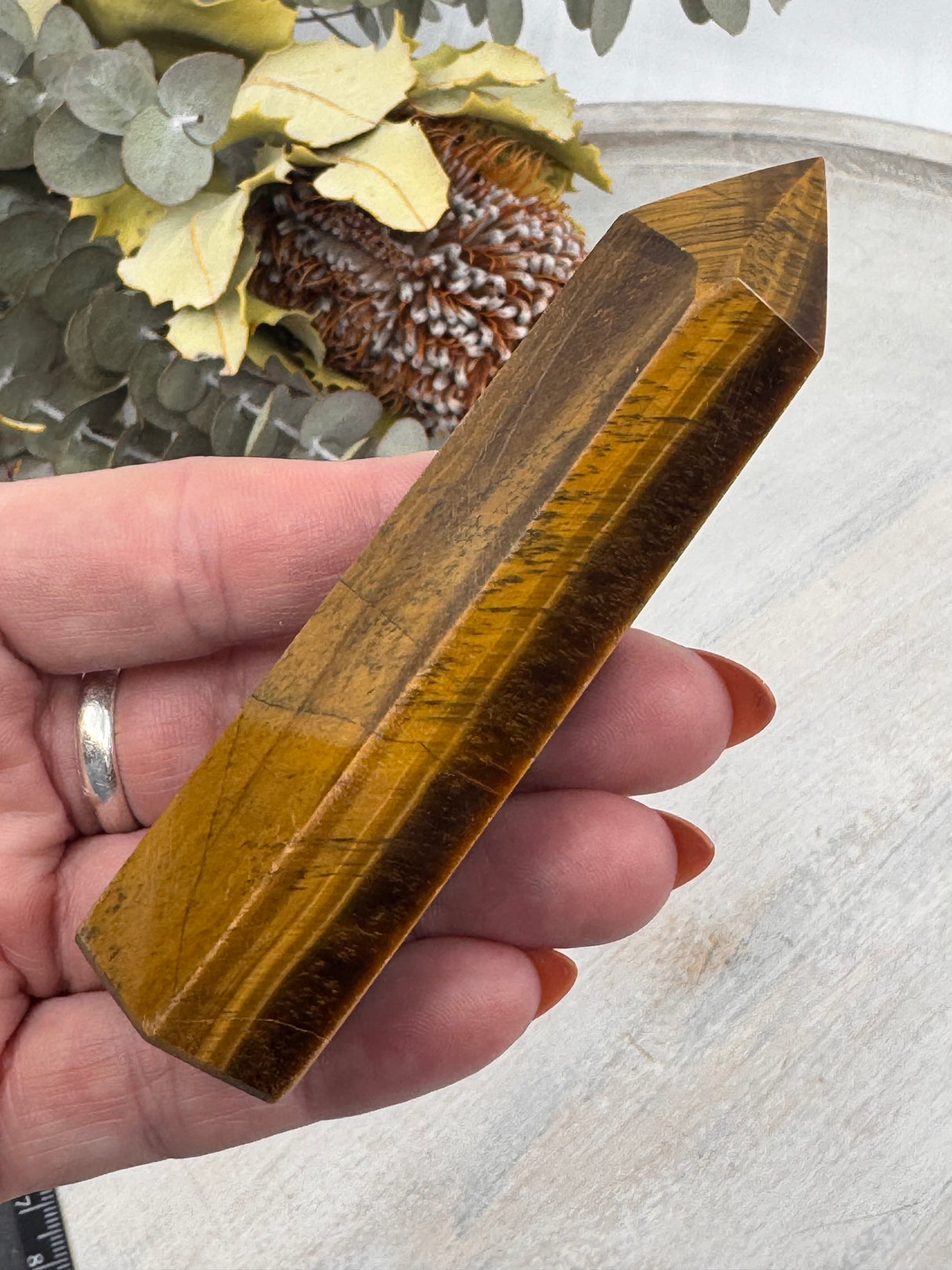 6-Sided Tiger Eye Point 10 cm × 3 cm – golden-brown crystal point symbolising courage, grounding and strength, Inspired By 3 Australia.