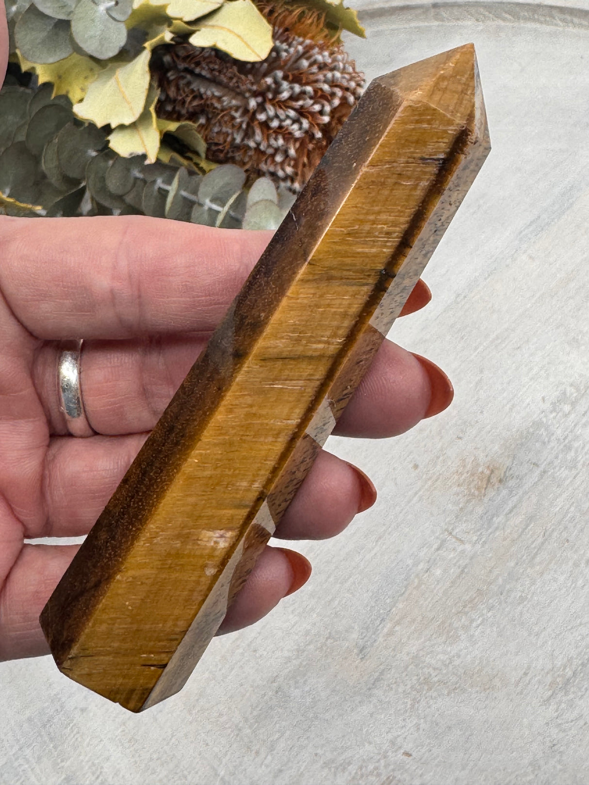 6-Sided Tiger Eye Point 10.5 cm × 2.5 cm – golden-brown crystal point symbolising courage, grounding and focus, Inspired By 3 Australia.