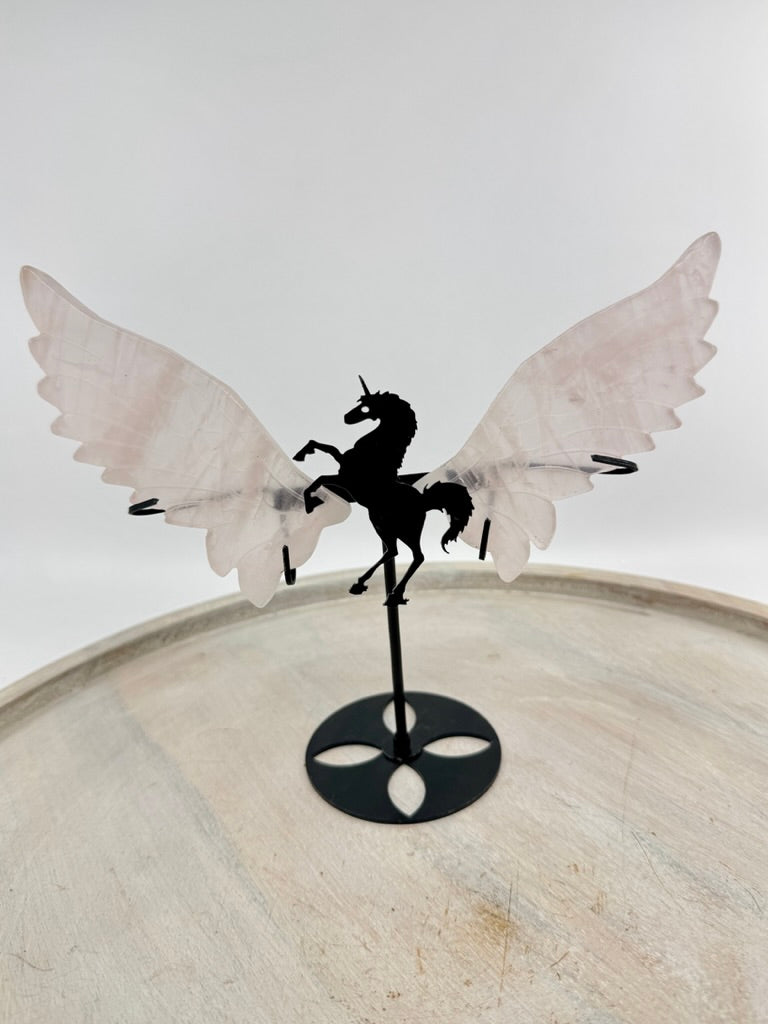 Rose Quartz unicorn wings carving on black stand – pink crystal display symbolising love, compassion and imagination – Inspired By 3 Crystals Australia.