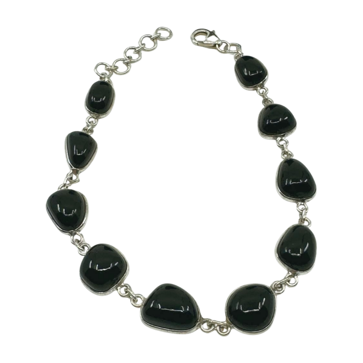 Sterling silver Black Onyx bracelet with polished black gemstones displayed beside ruler for size reference.