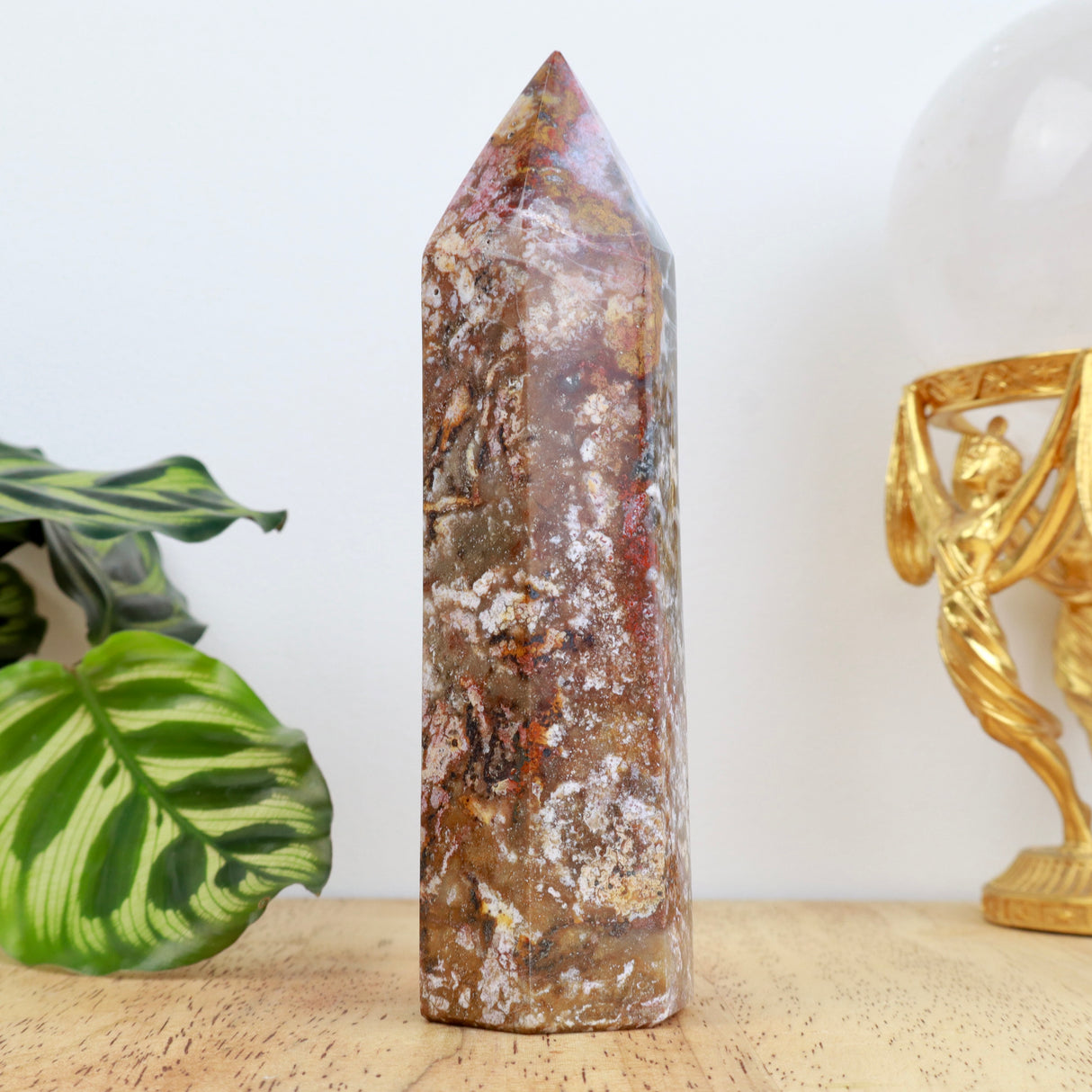 14cm Ocean Jasper point weighing 307g with red, cream and earthy marbled patterns polished into a point.