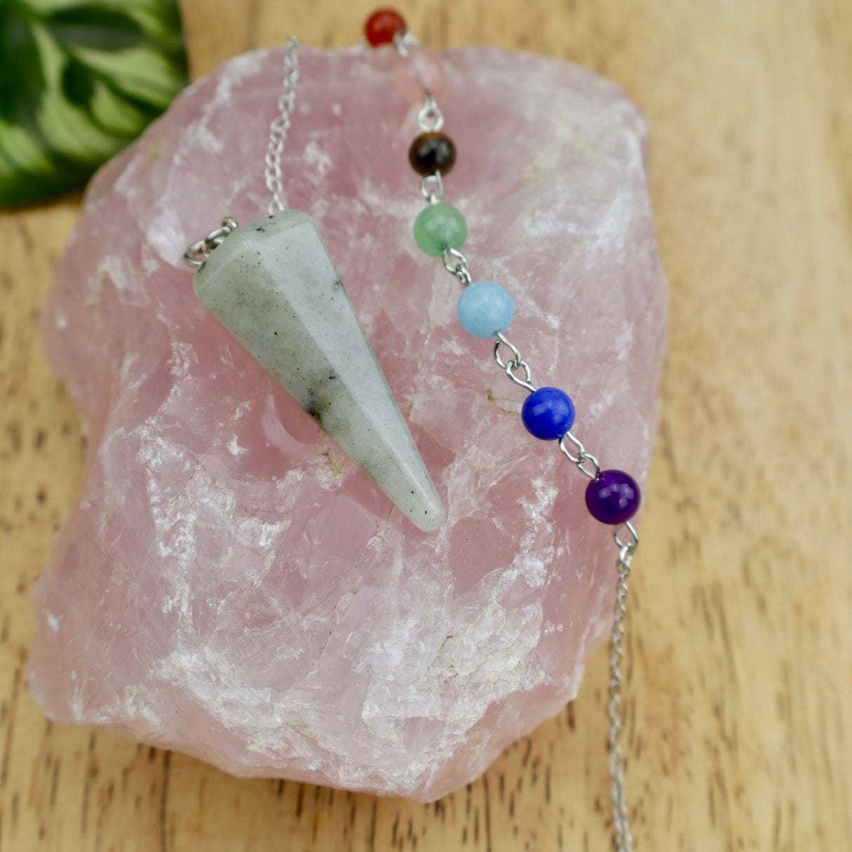 Labradorite crystal pendulum with chakra bead chain showing blue flash for intuition and psychic protection