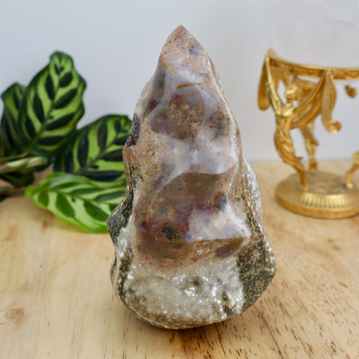 969g Ocean Jasper flame crystal measuring 15cm x 9cm with green, cream and earthy patterning displayed on wooden surface.