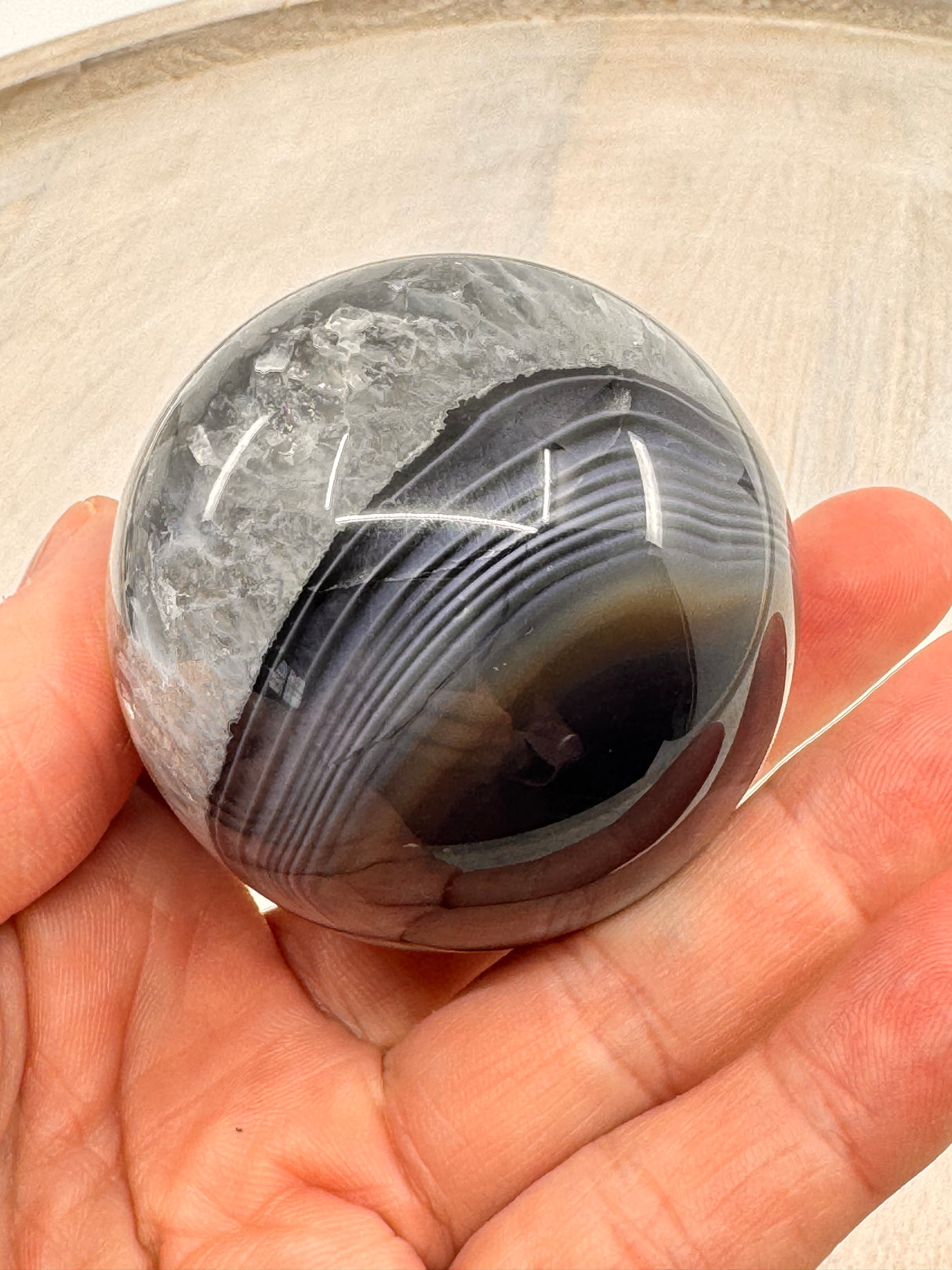 Banded Black Agate Sphere 230g - "I release all behaviours that no longer serve me."