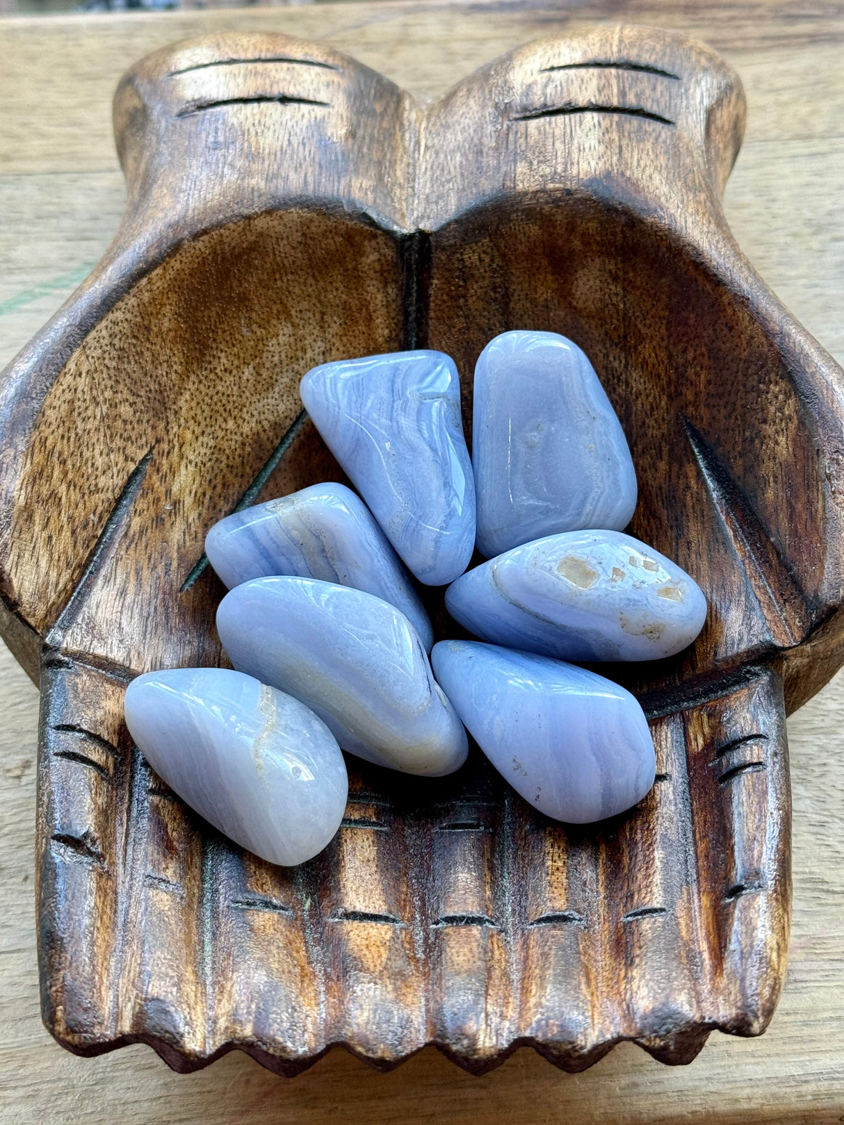 Blue Lace Agate tumbled stone with soft sky-blue bands — crystal of calm communication, peace, and emotional healing.