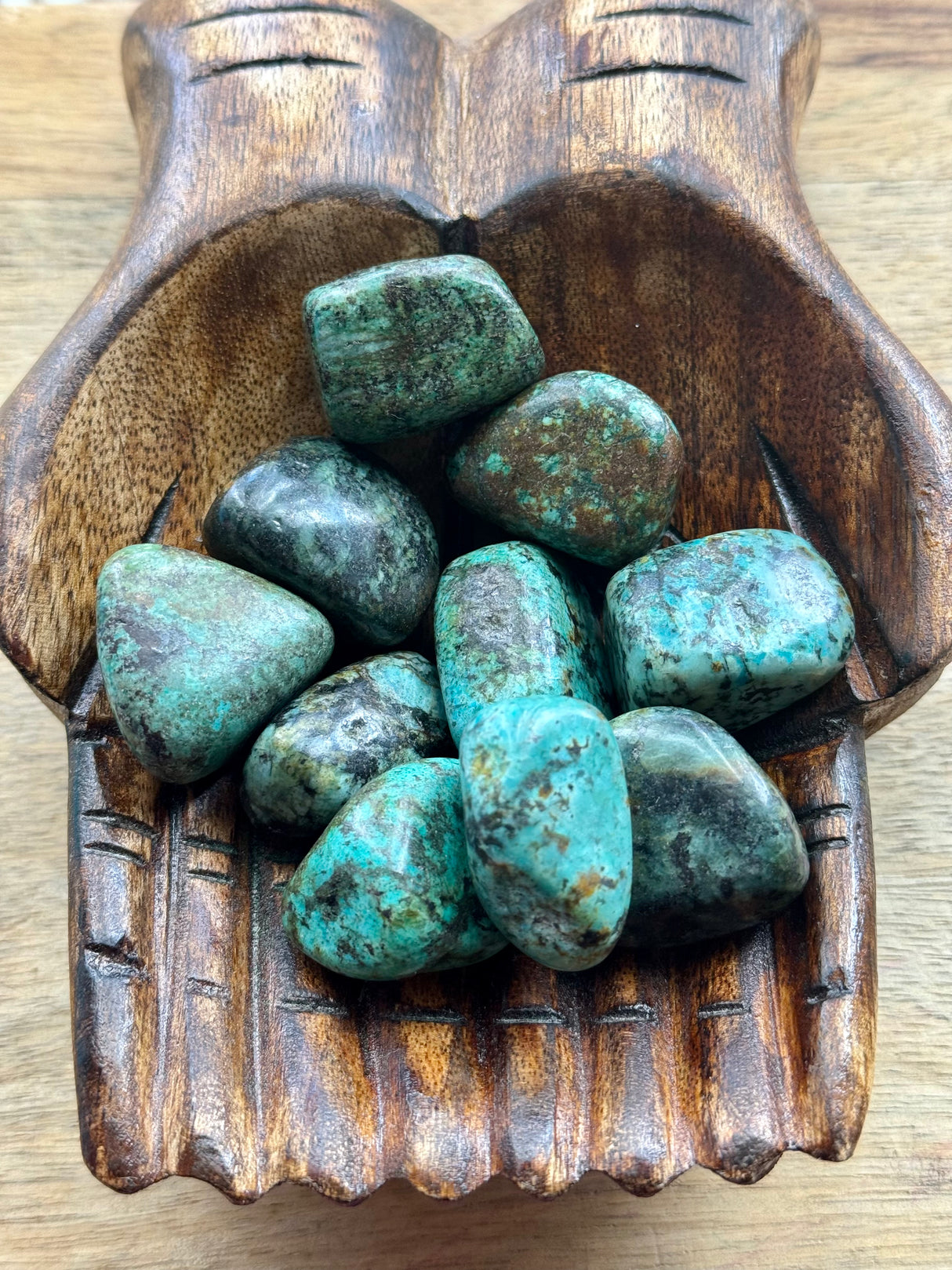 African Turquoise tumbled stone in earthy blue-green tones — crystal of evolution, balance, and transformation.