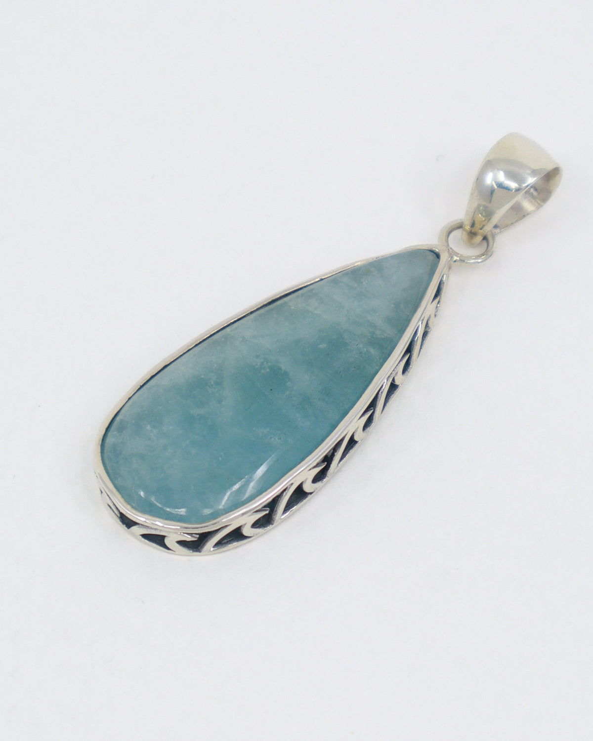 Natural Aquamarine sterling silver pendant with soft ocean blue elongated teardrop gemstone, decorative .925 silver setting and complimentary snake chain.