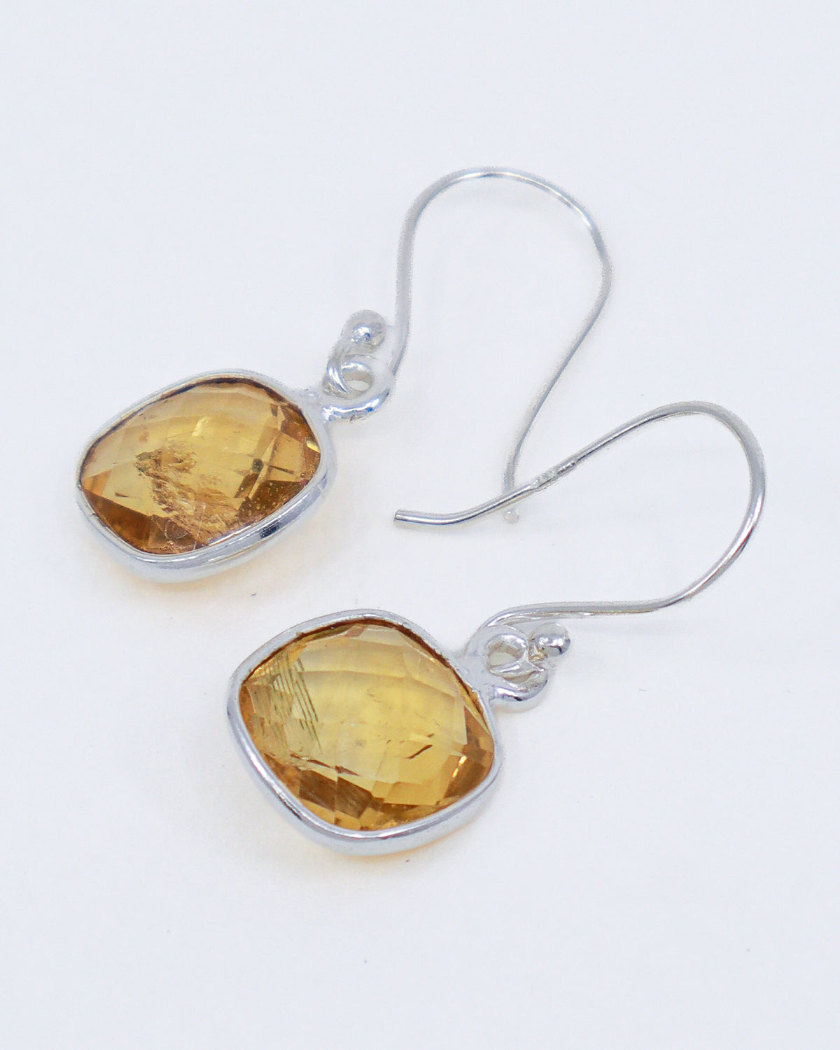 Natural Citrine earrings in .925 sterling silver with faceted golden yellow gemstones, abundance and manifestation crystal jewellery Australia.