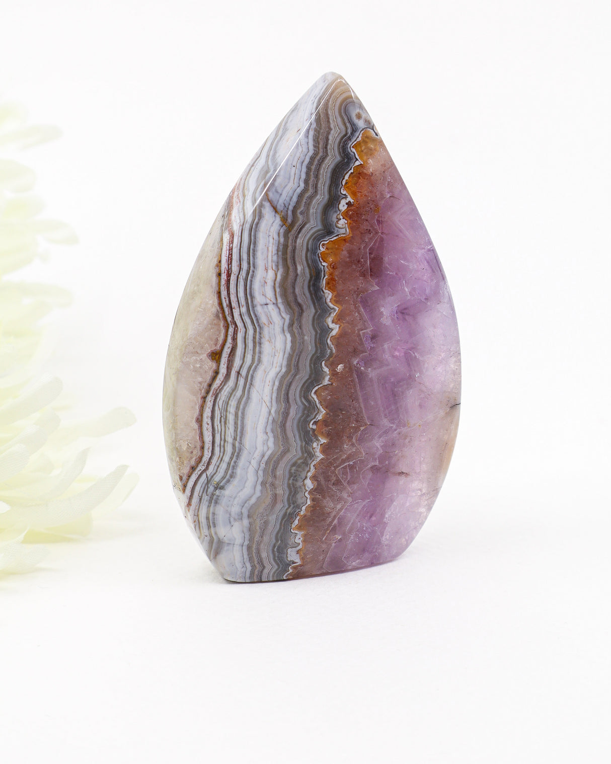 Polished Chevron Amethyst freeform featuring dramatic natural banding, lavender Amethyst and layered Quartz formations associated with intuition and spiritual awareness.