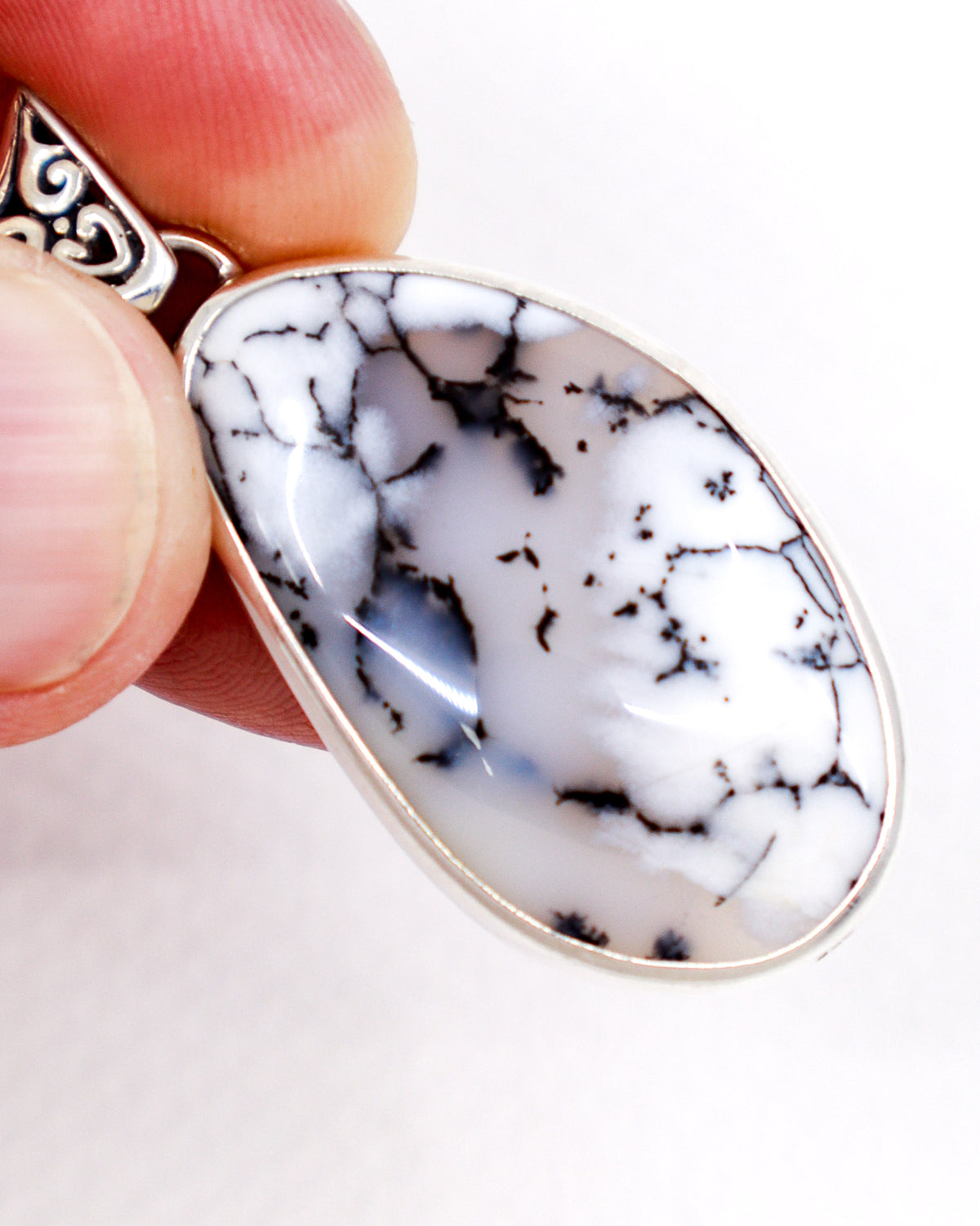 Natural Dendritic Agate sterling silver pendant with black tree-like dendritic inclusions through white and translucent grey Agate and ornate silver bail.