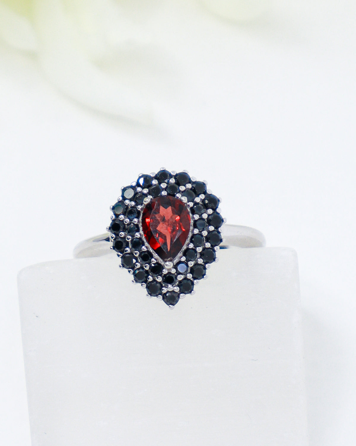 Natural Garnet and Black Spinel sterling silver ring Size 7 with pear cut red Garnet surrounded by faceted Black Spinel gemstones.