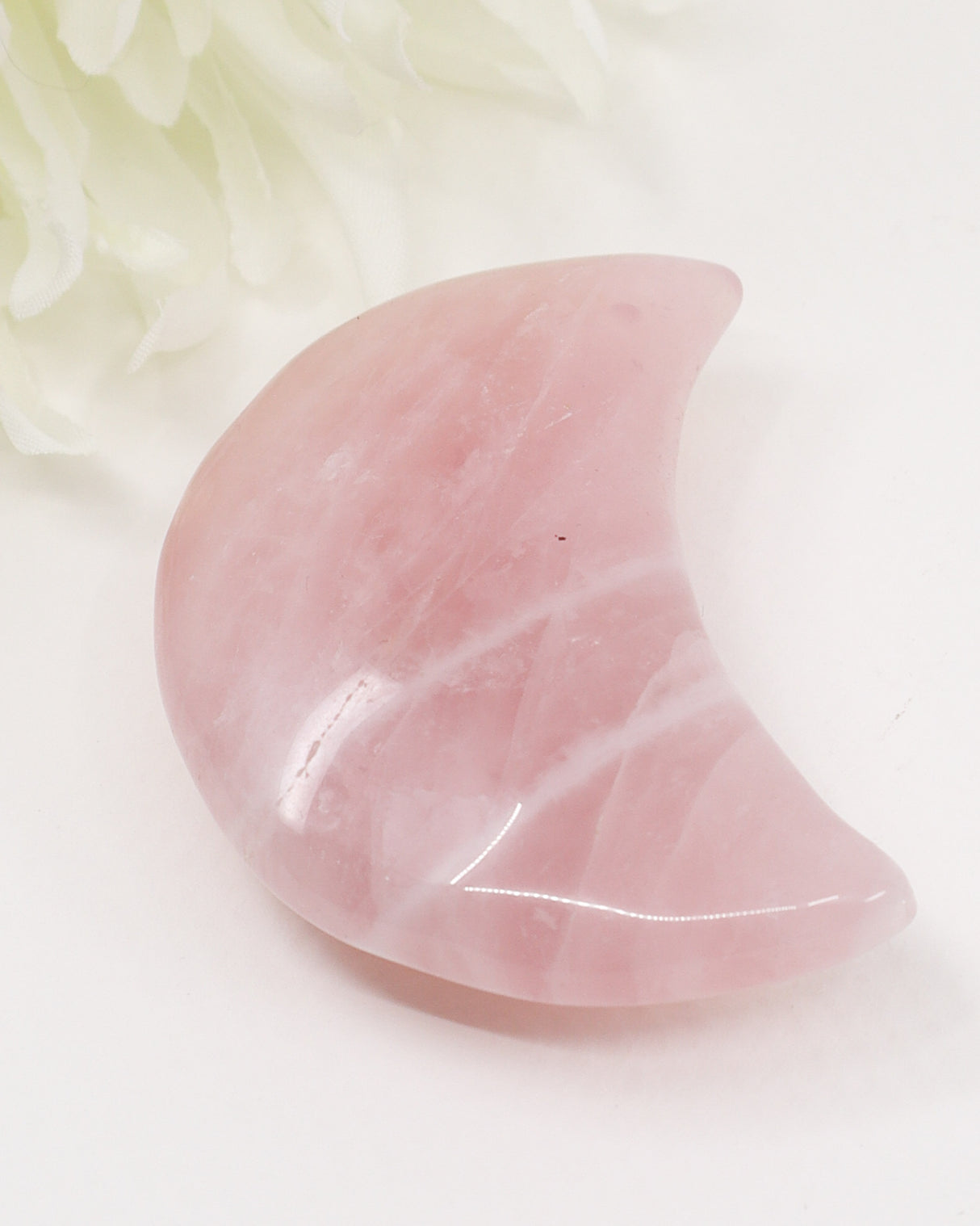 Natural Rose Quartz crescent moon crystal carving approximately 7cm with soft pink colouring