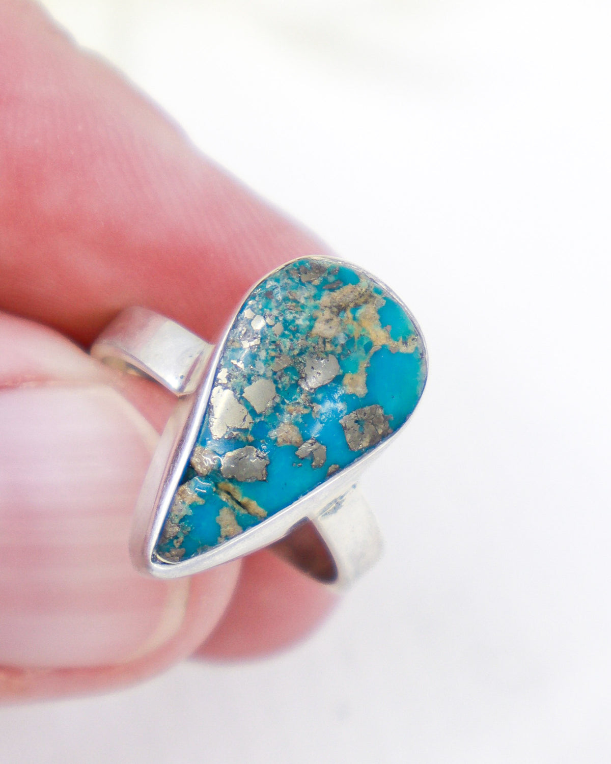 Turquoise sterling silver ring Size 7 with pear-shaped blue stone and metallic matrix, spiritual protection and truth crystal jewellery.