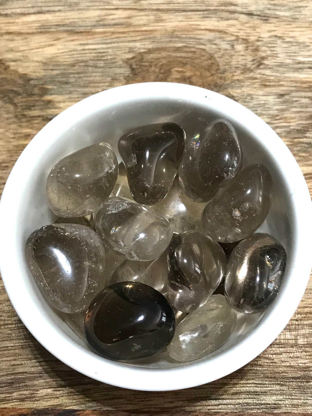 Smoky Quartz tumbled stone in rich brown tones — crystal of grounding, protection, and transformation.