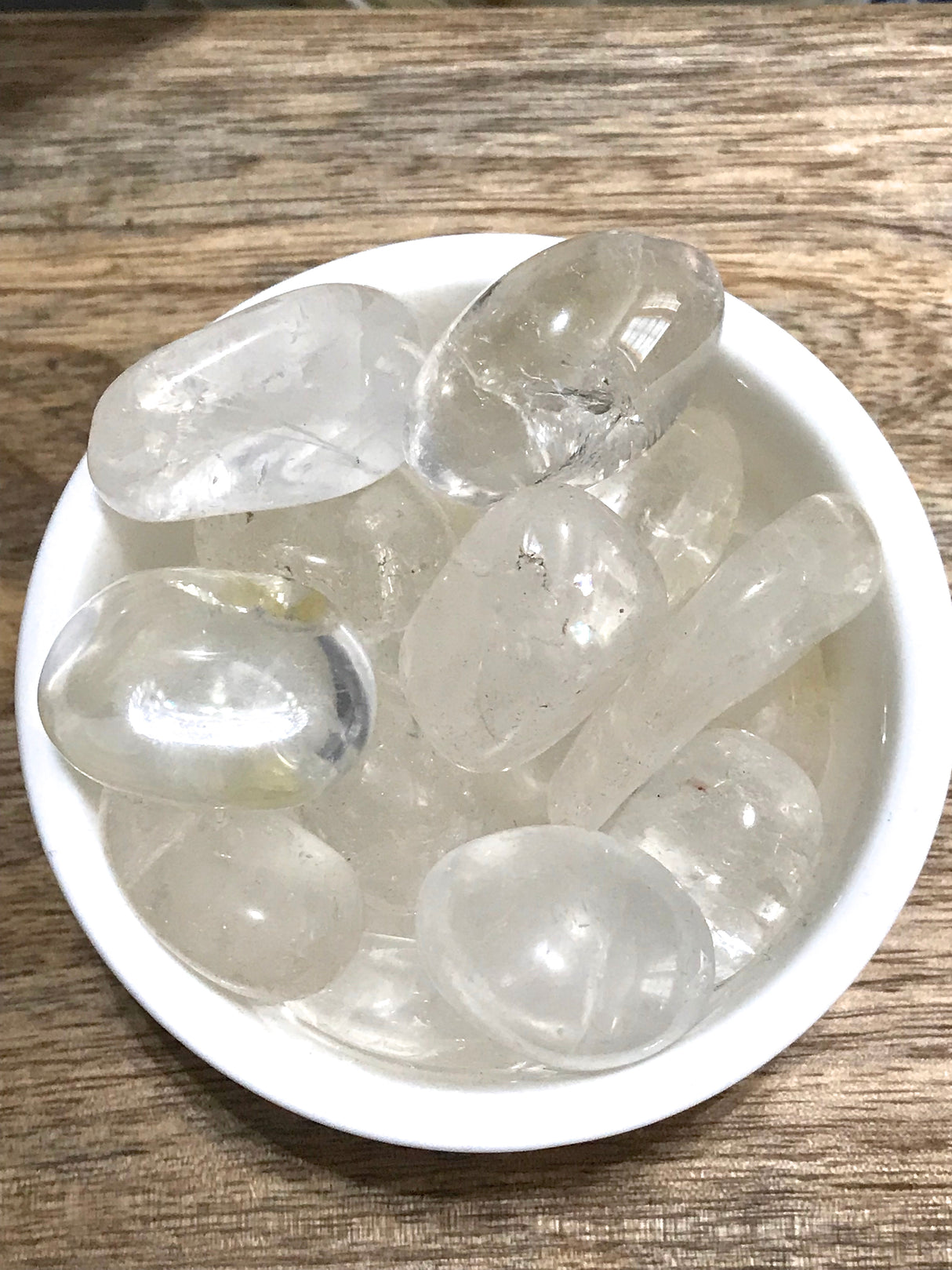 Clear Quartz tumbled stone with transparent clarity — crystal of energy, clarity, and spiritual amplification.