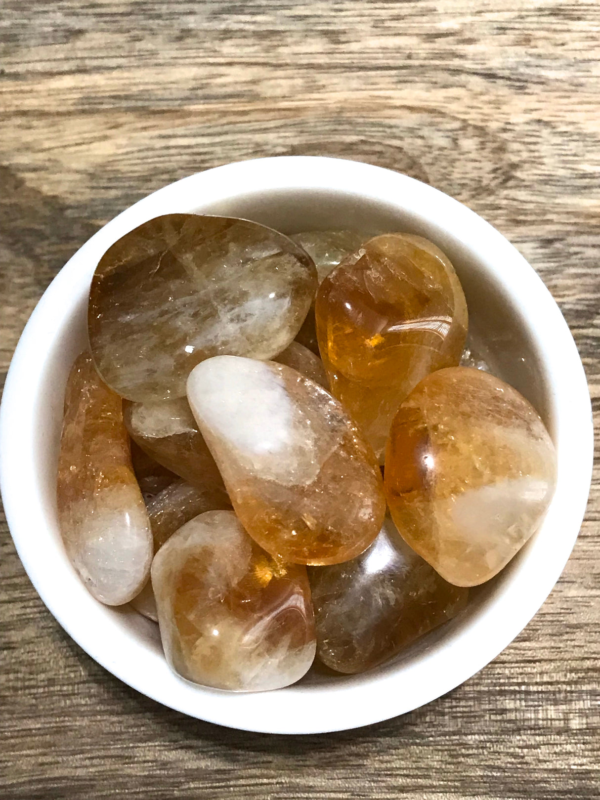Citrine tumbled stone in golden yellow tones — crystal of abundance, joy, and manifestation.