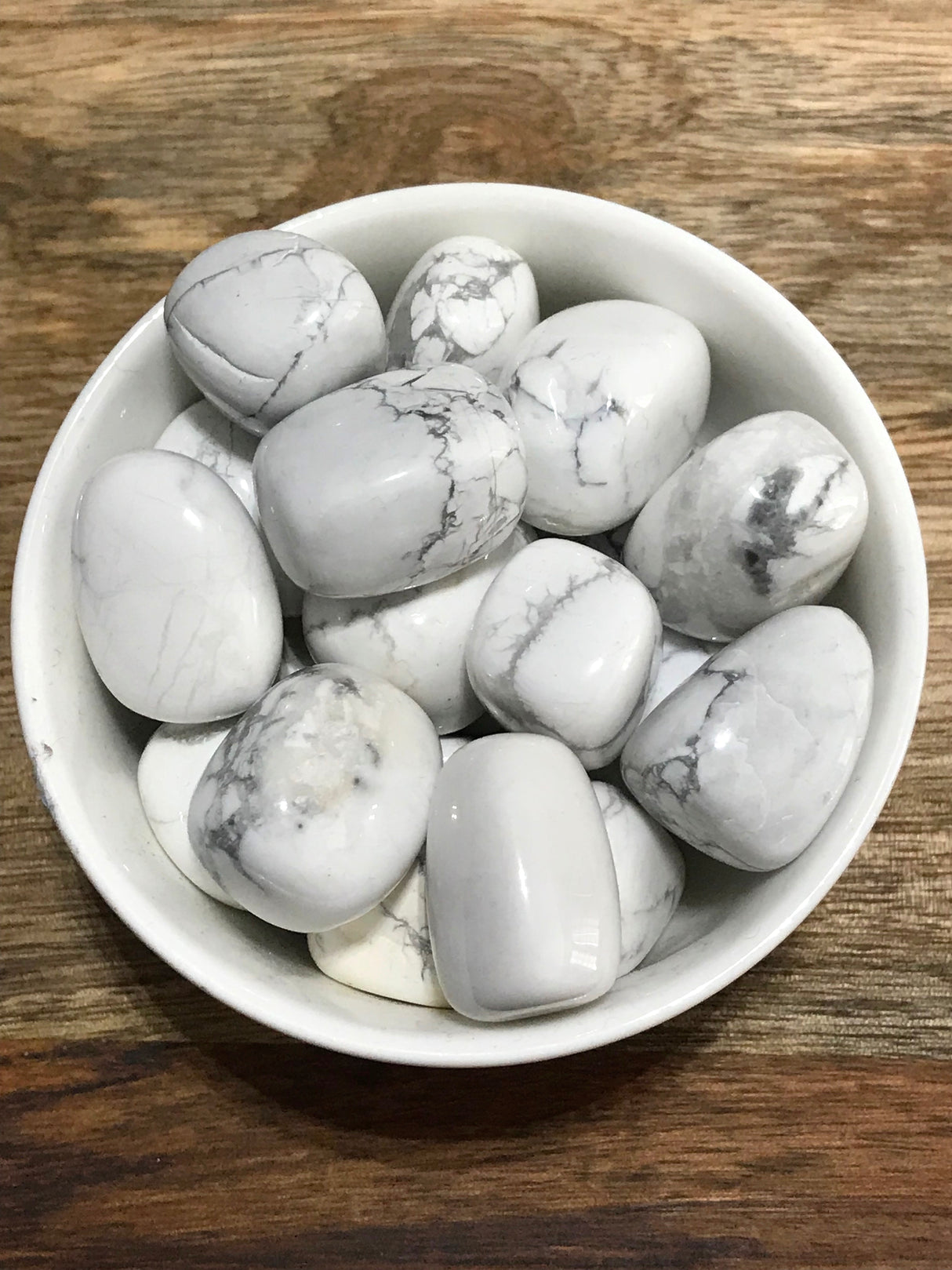 Howlite tumbled stone in white with grey marbling — crystal of calm, awareness, and patience.