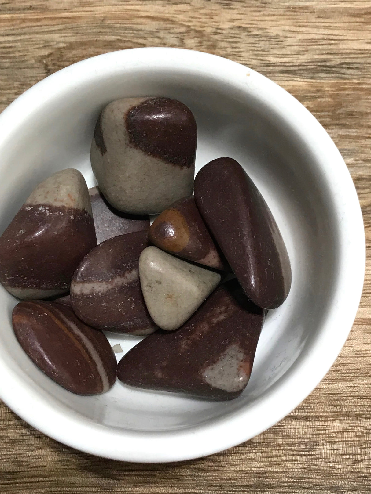 Shiva Lingam tumbled stone in natural brown and taupe tones — sacred crystal of balance, transformation, and divine unity.