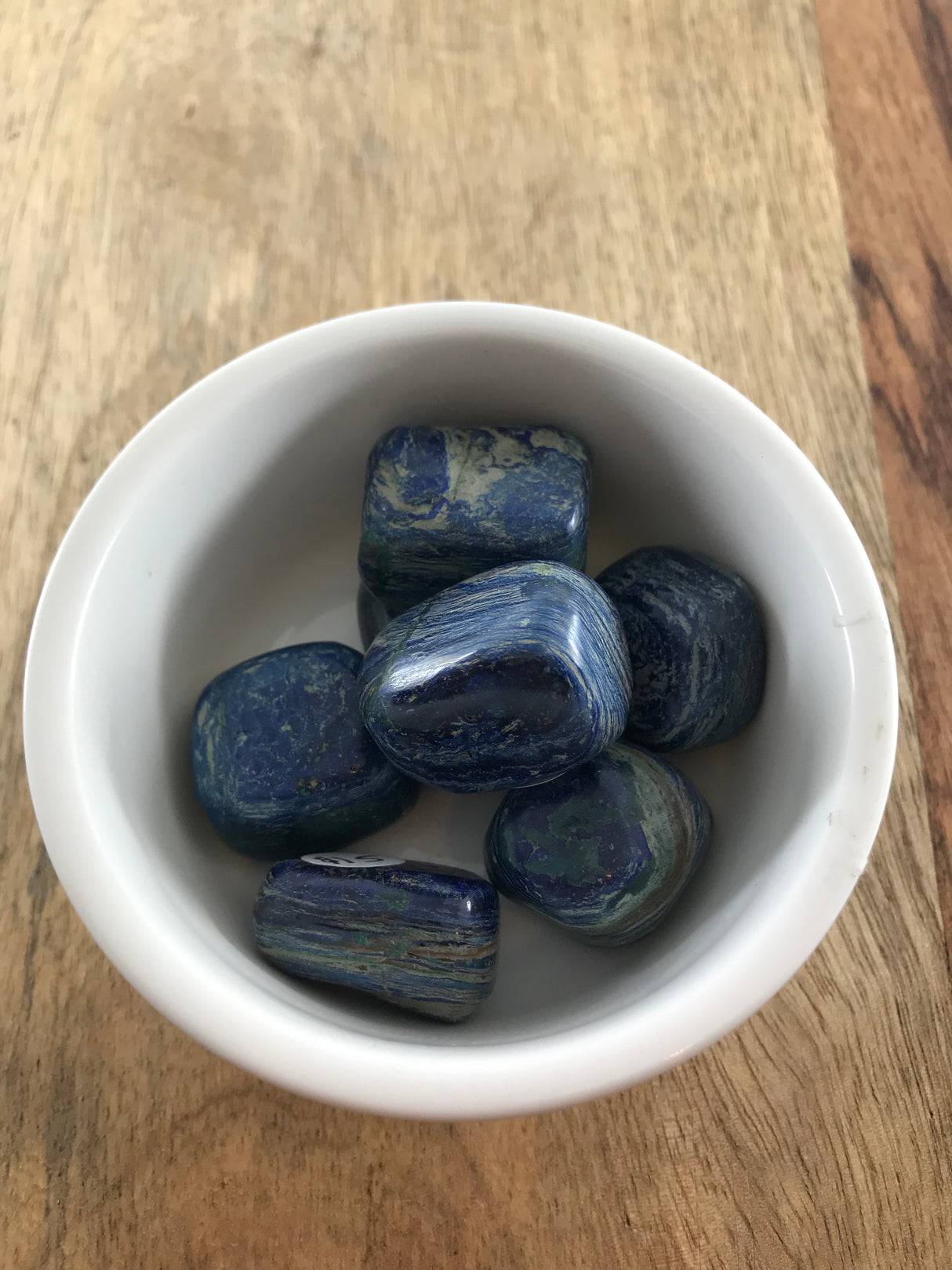 Azurite tumbled stone in deep indigo-blue tones — crystal of intuition, insight, and transformation.
