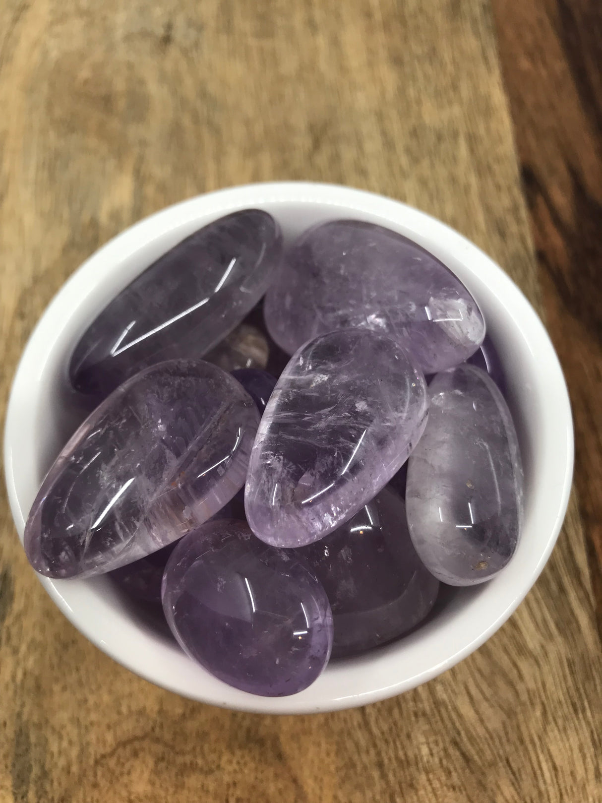 Amethyst tumbled stone in rich purple hues — crystal of peace, intuition, and spiritual protection.