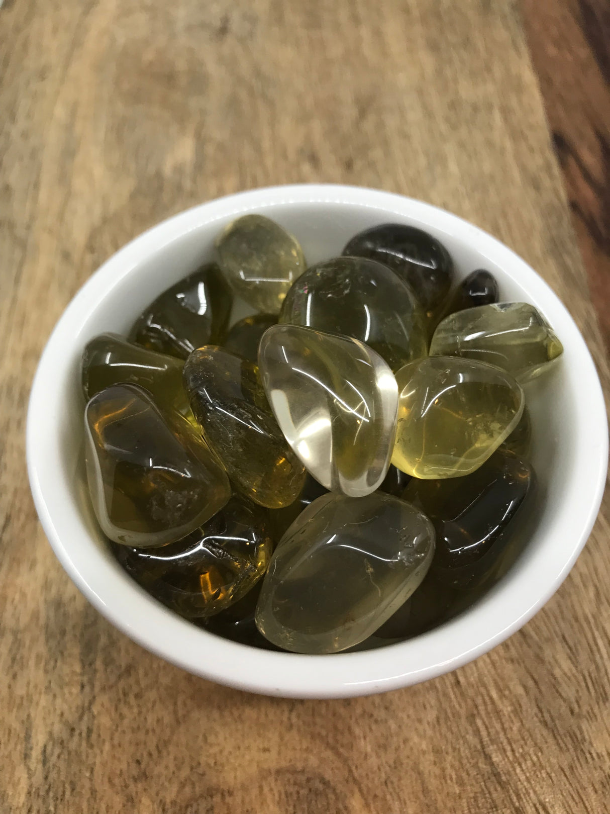 Lemon Quartz tumbled stone in bright golden-yellow tones — crystal of optimism, clarity, and manifestation.