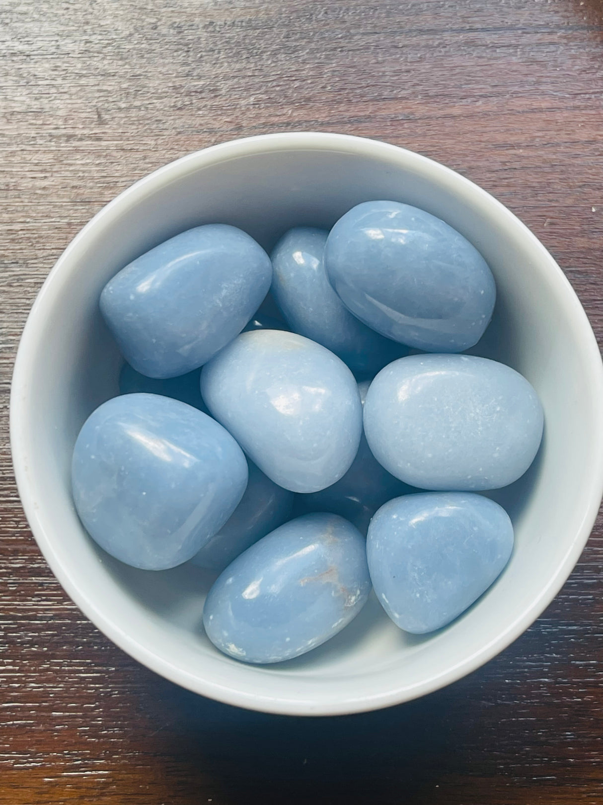 Angelite tumbled stone in soft blue tones — crystal of serenity, compassion, and angelic communication.