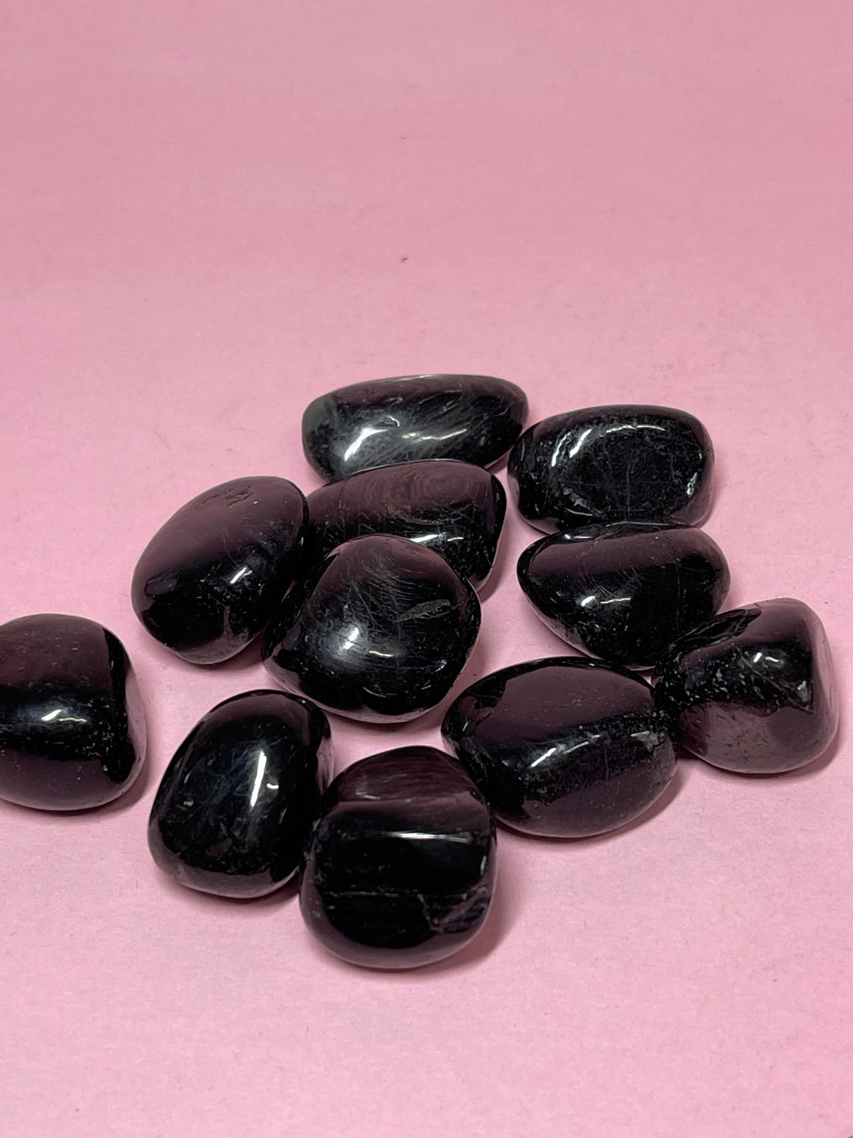 Hypersthene tumbled stone with metallic sheen — crystal of intuition, protection, and inner strength.