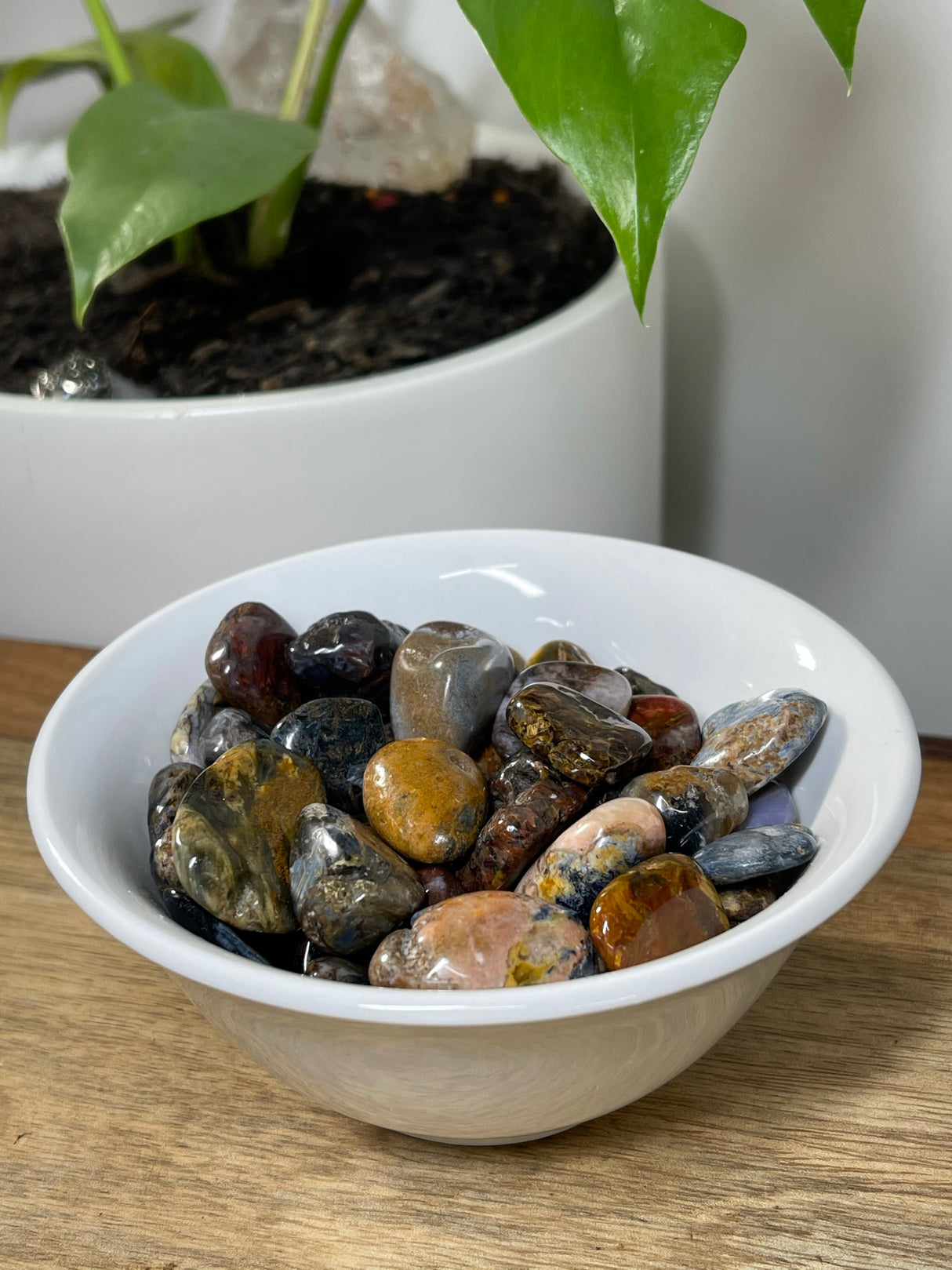 Pietersite tumbled stone with swirling blue, gold, and red patterns — crystal of transformation, courage, and divine truth.
Would you like me to move on to Petrified Wood, Prehnite, or Pyrite next?
