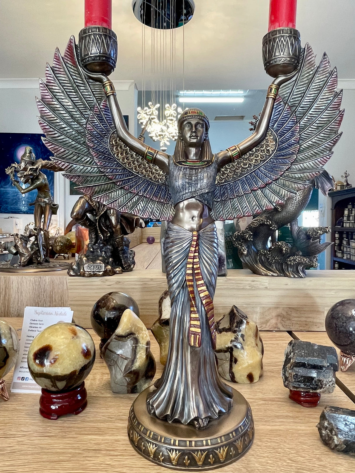 "Isis candle holder bronze statue with wings outstretched – Egyptian Goddess of Magic, Healing and Fertility holding candles of divine light"