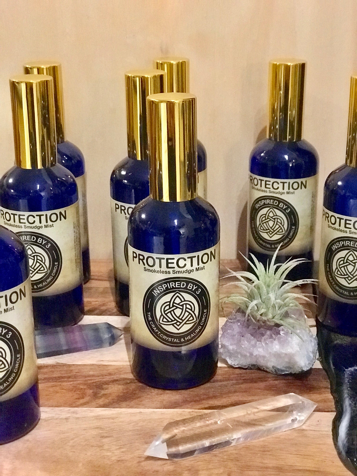 Protection & Cleansing Mist in a 100ml glass bottle with gold atomiser and Black Tourmaline, infused with Palo Santo, Sage, and Frankincense, Reiki-activated by Inspired By 3.