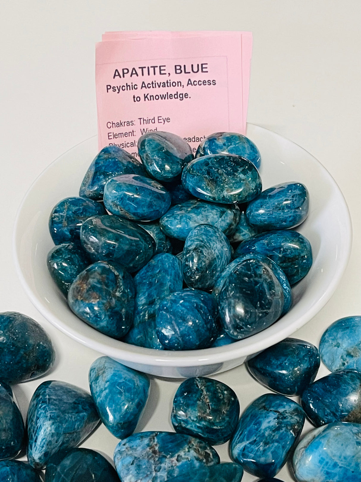 Blue Apatite tumbled stone in deep ocean hues — crystal of inspiration, motivation, and manifestation.