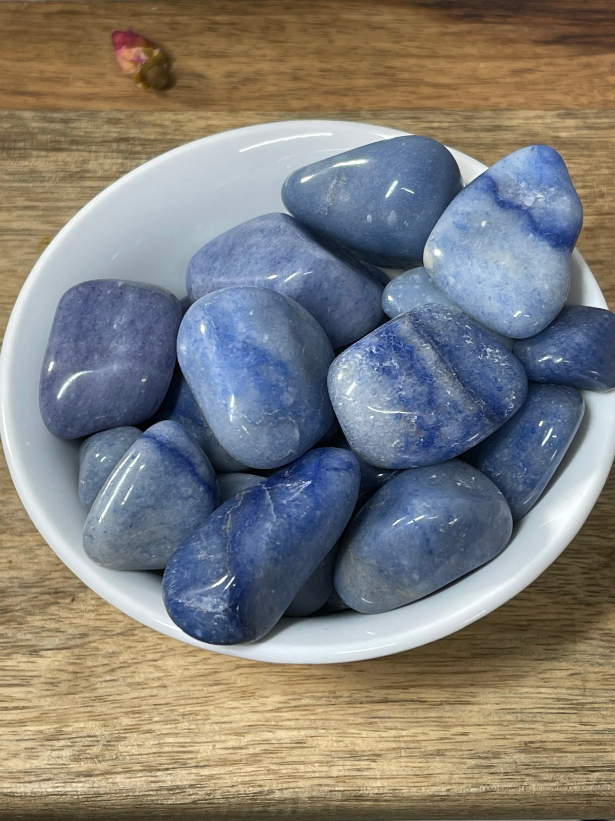 Blue Aventurine tumbled stone in soft indigo-blue tones — crystal of focus, strength, and spiritual insight.