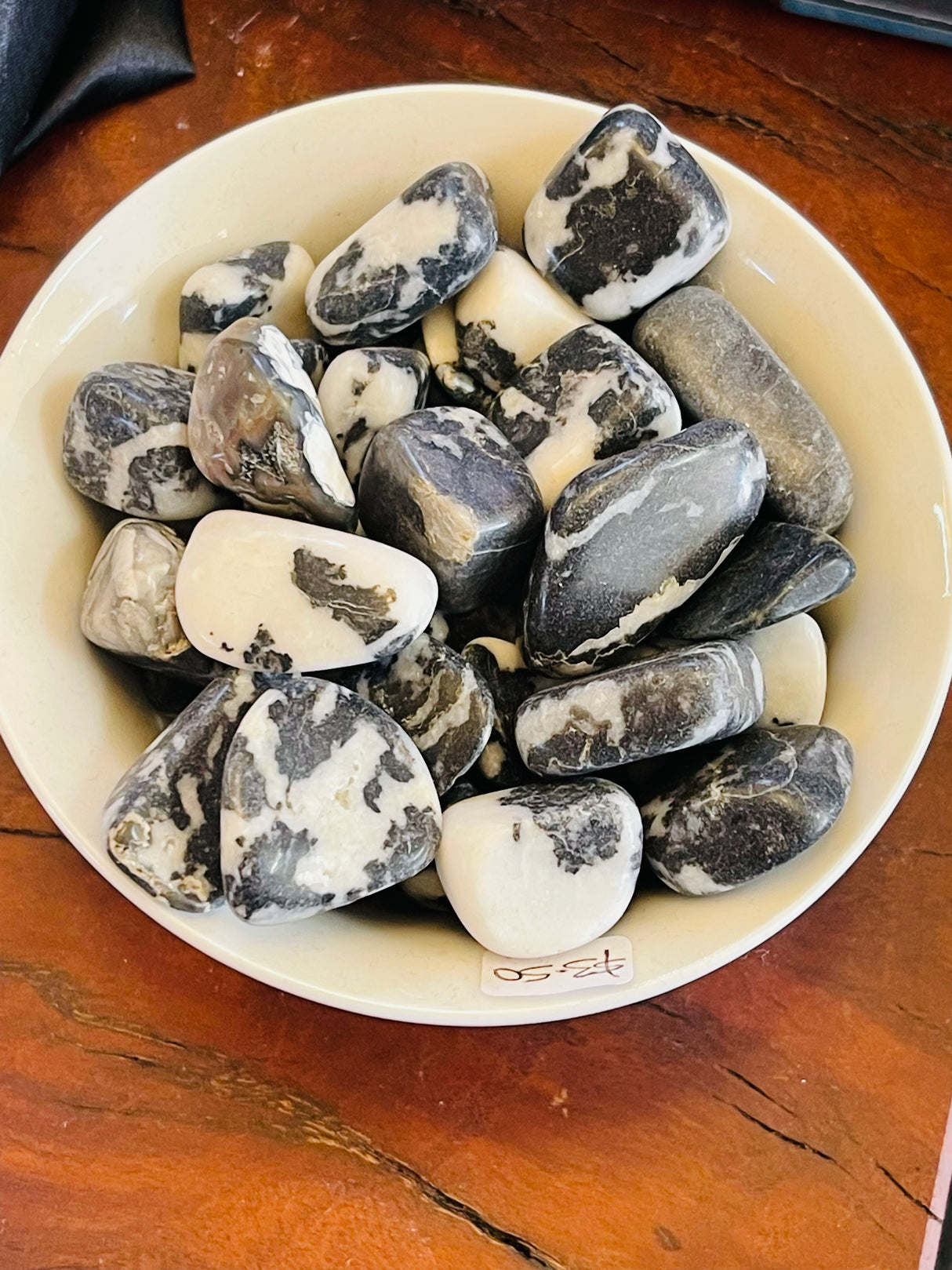 Zebra Jasper tumbled stone with natural black and white stripes — crystal of balance, motivation, and inner harmony.