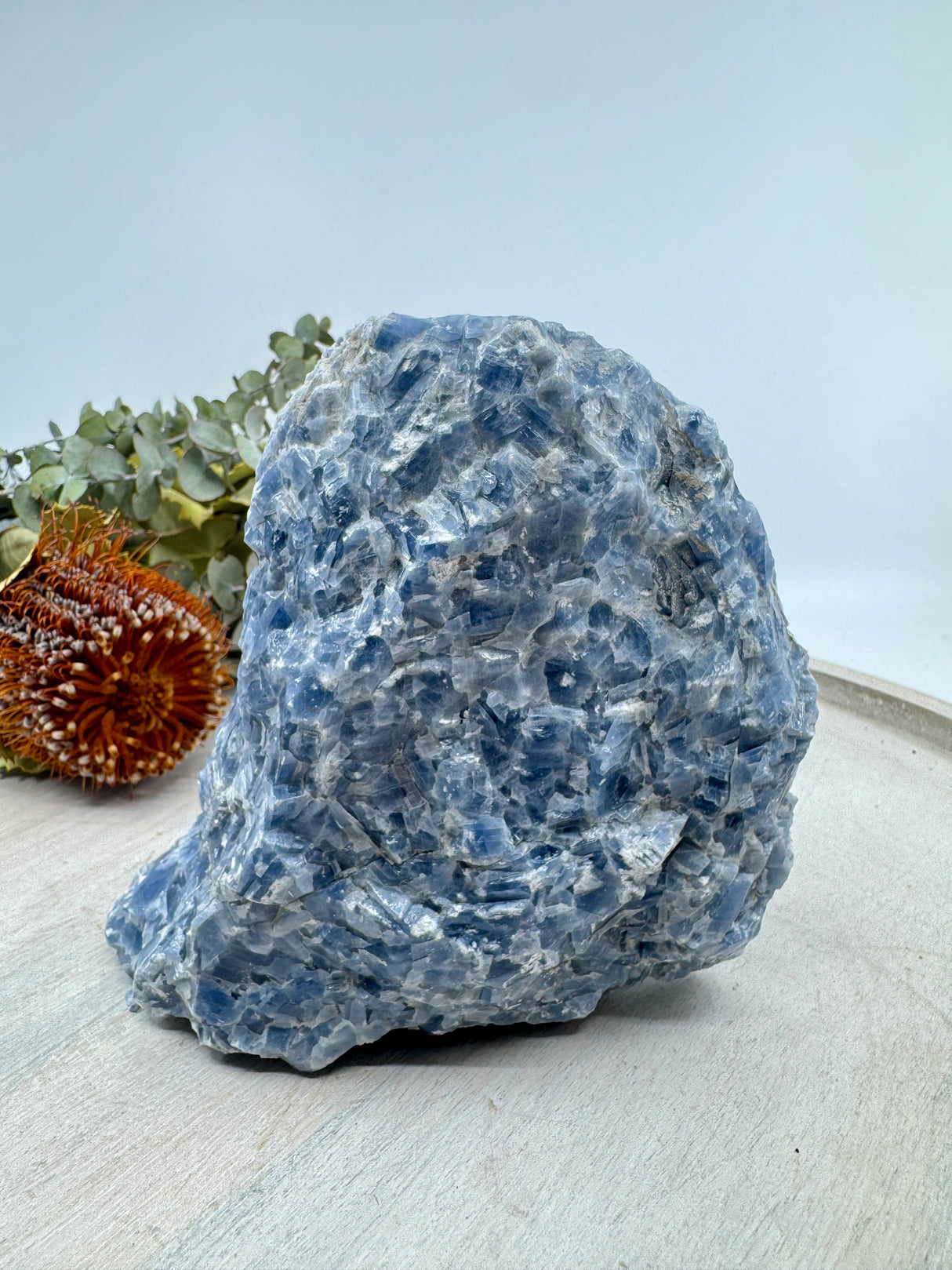 Natural Blue Calcite crystal chunk in soft sky-blue tones — stone of calm, communication, and gentle healing.