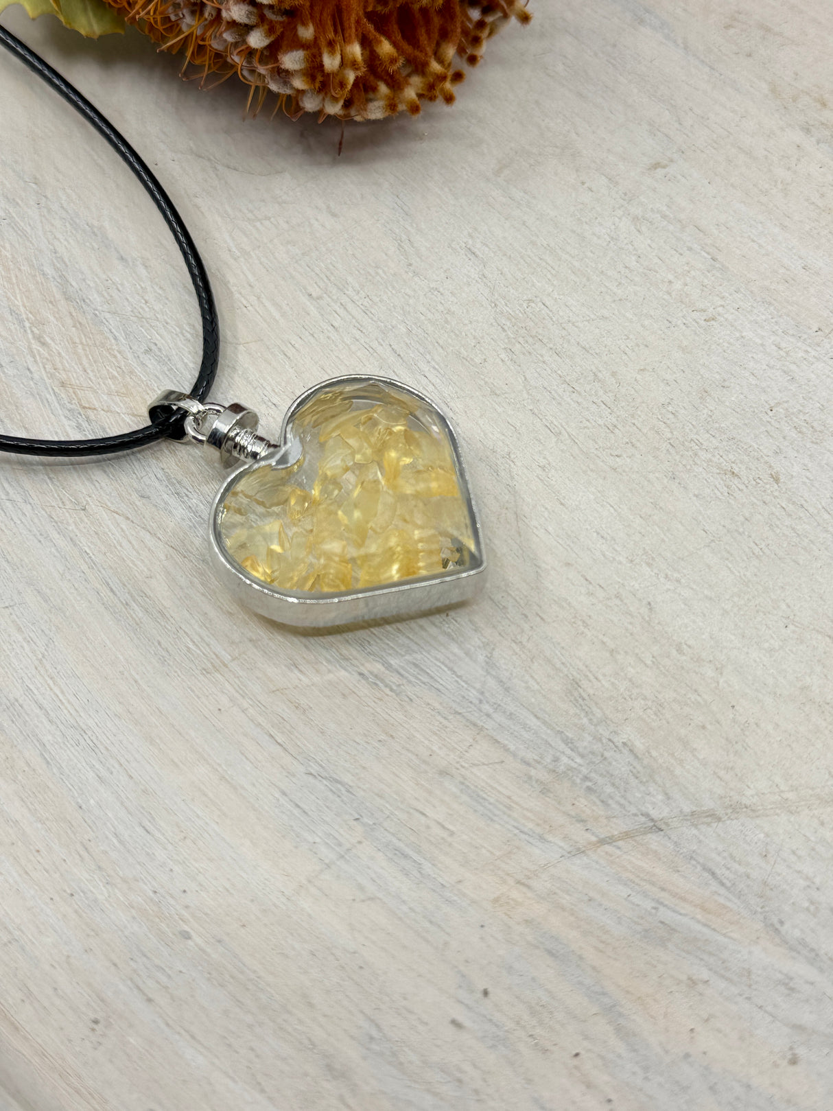 Citrine heart bottle pendant 40x32x11mm glass with platinum-plated alloy – filled with golden crystal chips for joy, success and abundance – Inspired By 3 Crystals Australia.