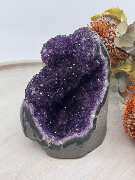 Amethyst crystal cluster with calming deep violet hues for spiritual growth and energy work.
