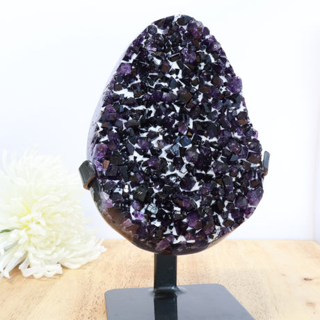 Uruguayan amethyst druzy cluster with deep purple crystals and calcite on black stand, 2.2kg statement piece.
