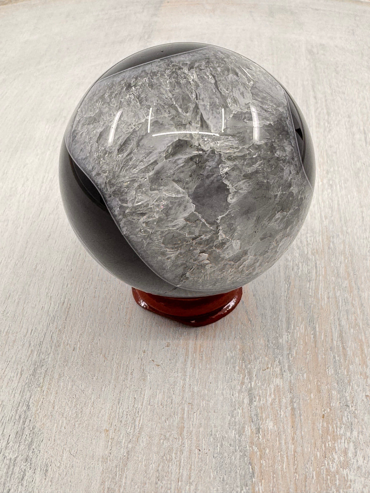 Banded Black Agate Sphere 279g - "I release all behaviours that no longer serve me."
