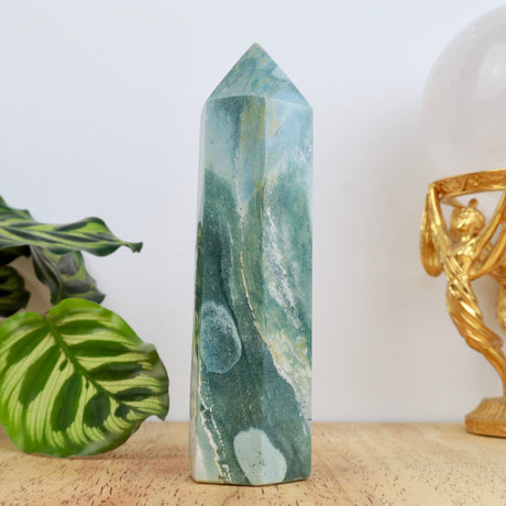 13.5cm Ocean Jasper point weighing 292g with green, white and subtle golden marbling polished into a double-terminated point.