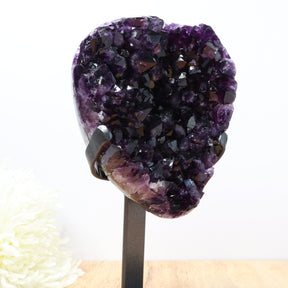 Dark uruguayan amethyst druzy cluster on black stand with deep purple crystals, 2.16kg statement piece for home or altar.