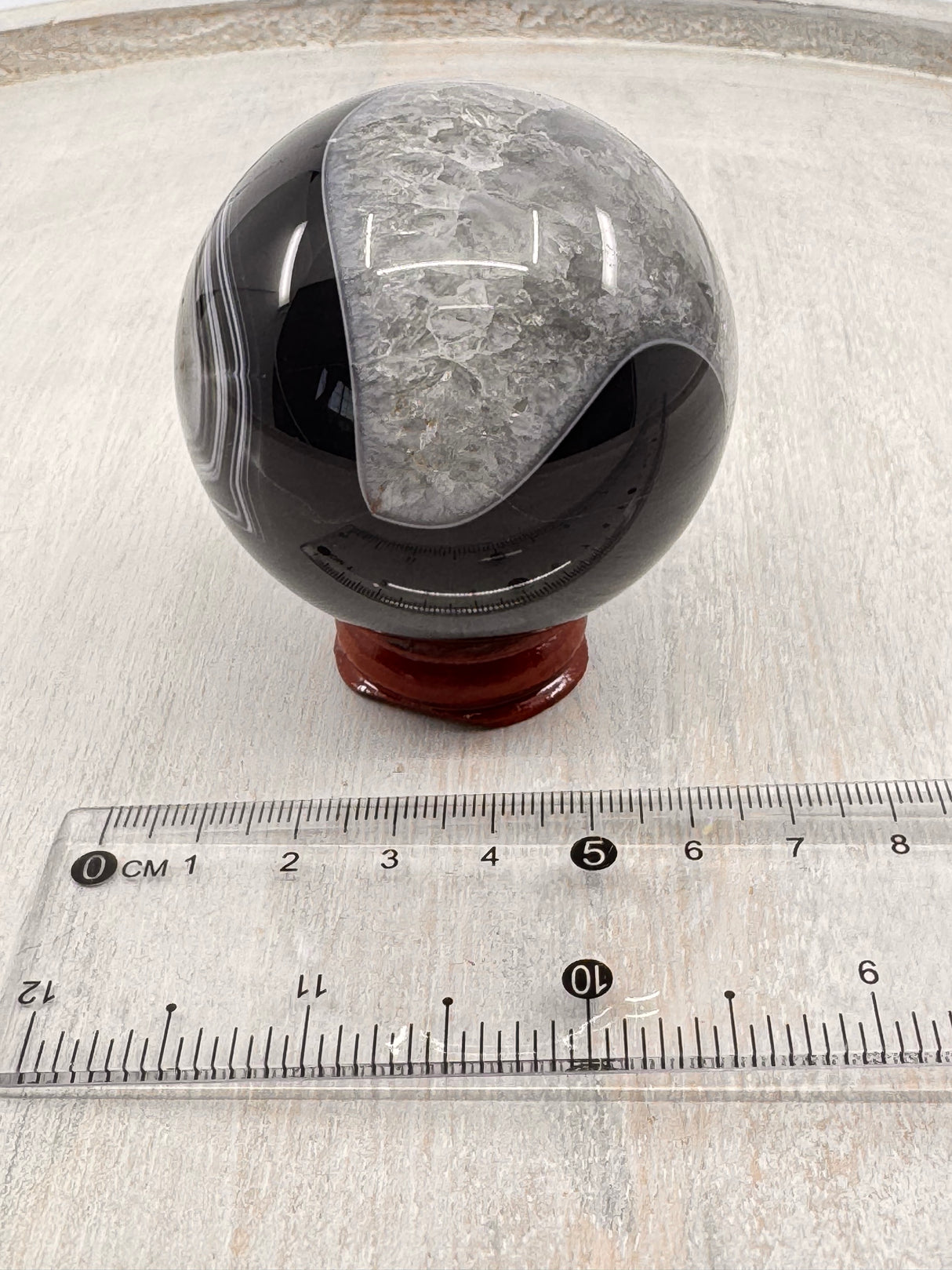 Banded Black Agate Sphere 279g - "I release all behaviours that no longer serve me."