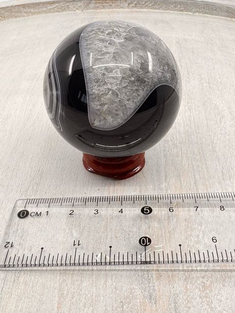 Banded Black Agate Sphere 279g - "I release all behaviours that no longer serve me."