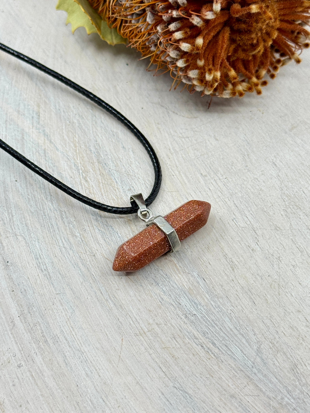 Goldstone double terminated pendant 3.5x2cm on black wax cord – shimmering orange crystal for ambition, confidence and positivity – Inspired By 3 Crystals Australia.