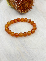 Carnelian stretch bracelet 10mm natural beads – 6cm inner diameter – orange crystal bracelet for vitality, creativity and confidence – Inspired By 3 Crystals Australia.