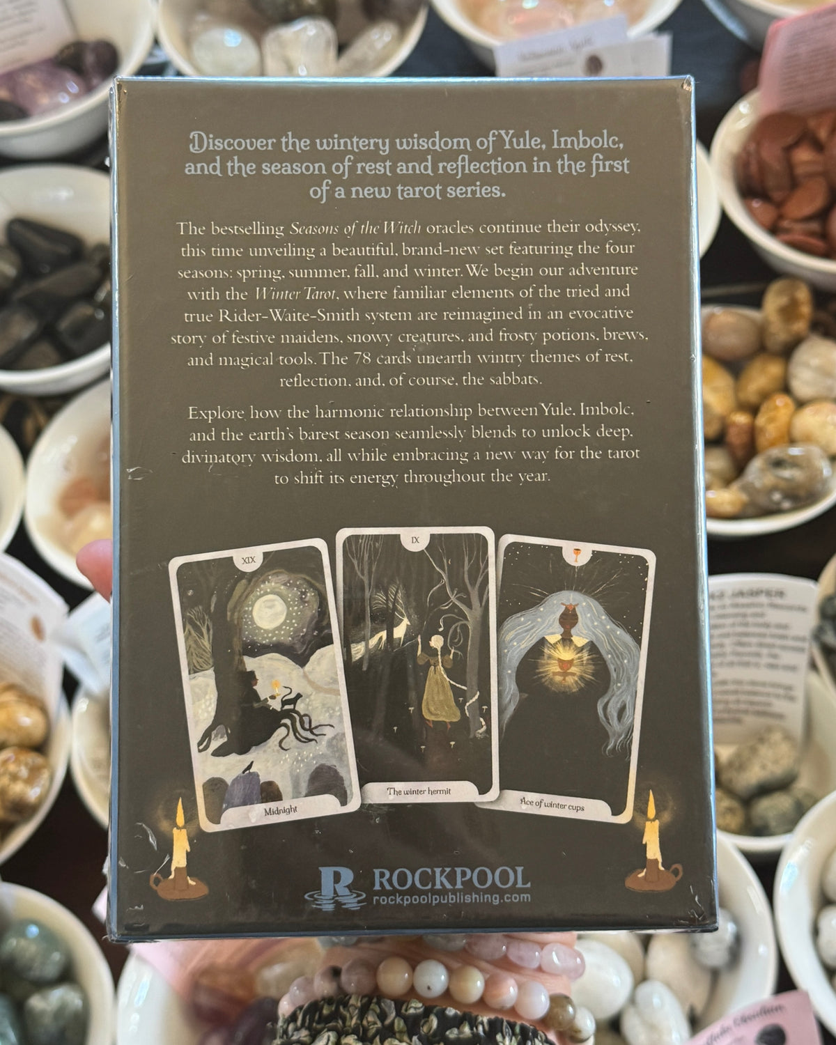Seasons of the Witch Winter Tarot 78 card deck by Lorraine Anderson, illustrated by Tijana Lukovic, magical Yule and Imbolc witchcraft tarot cards with winter goddesses and mystical seasonal artwork.