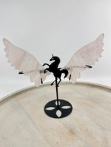 Rose Quartz unicorn wings carving on black stand – pink crystal display symbolising love, compassion and imagination – Inspired By 3 Crystals Australia.