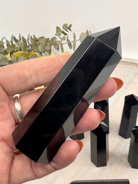 Black Obsidian Points 9–10 cm × 2.5 cm – glossy black crystal towers symbolising protection, grounding and transformation, intuitively selected by Inspired By 3 Australia.